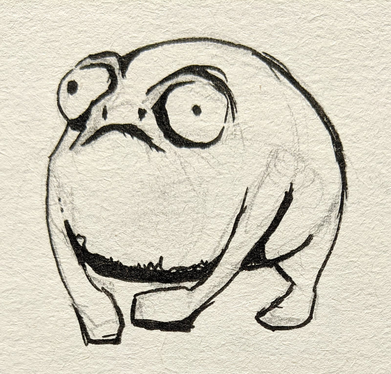 A funny failed sketch done in black ink on textured paper, depicting a very round frog. The creature has uneven, bulging eyes and a wide, wobbly frown, giving it a vacant, spaced out look rather than the intended angry expression.